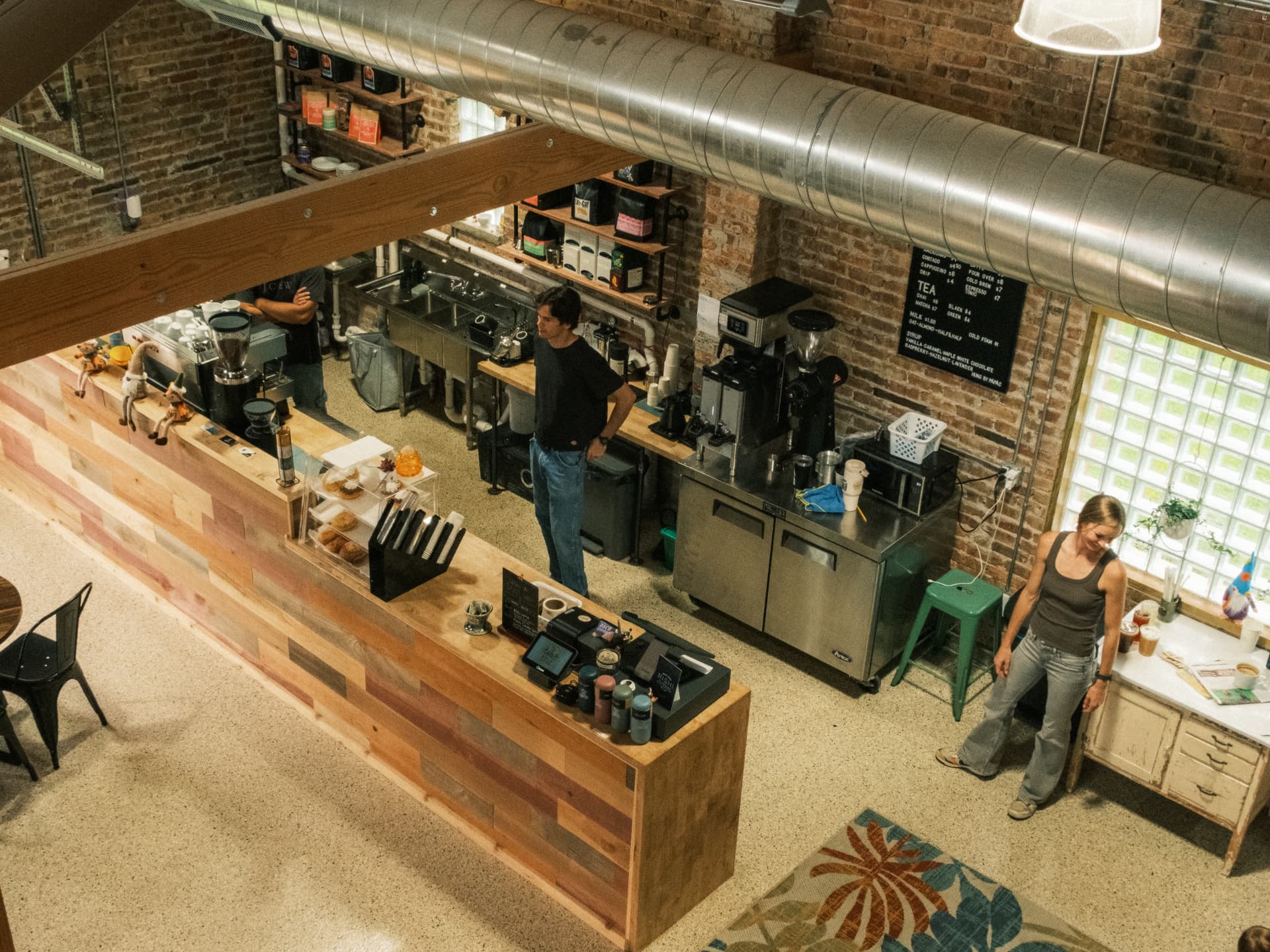 The full DSCO Coffee counter and bar seen from the loft
