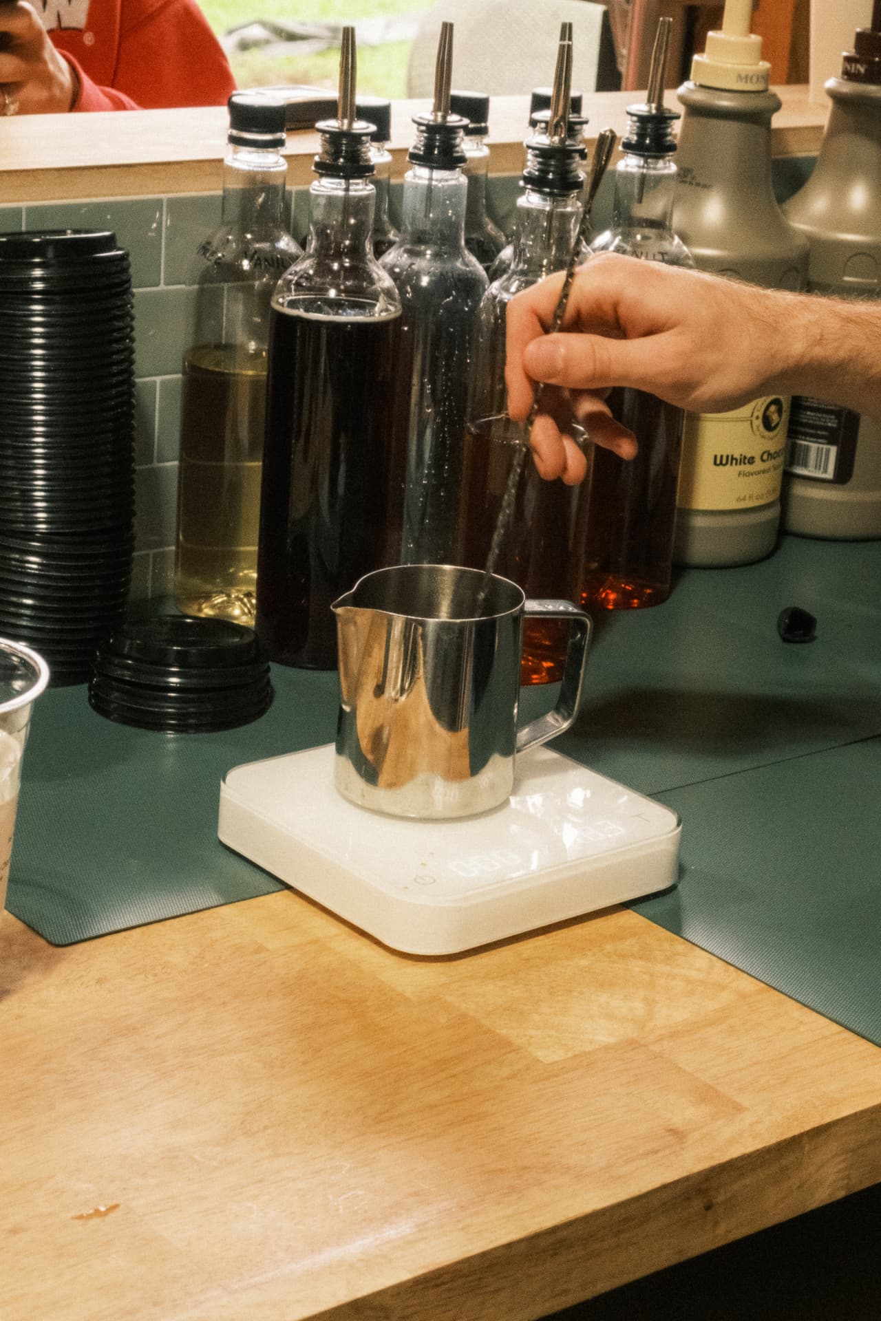 A drink being measured and mixed at the DSCO counter