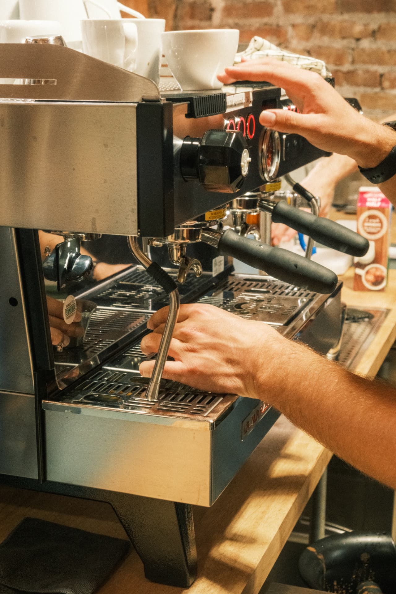A barista preparing the DSCO espresso machine